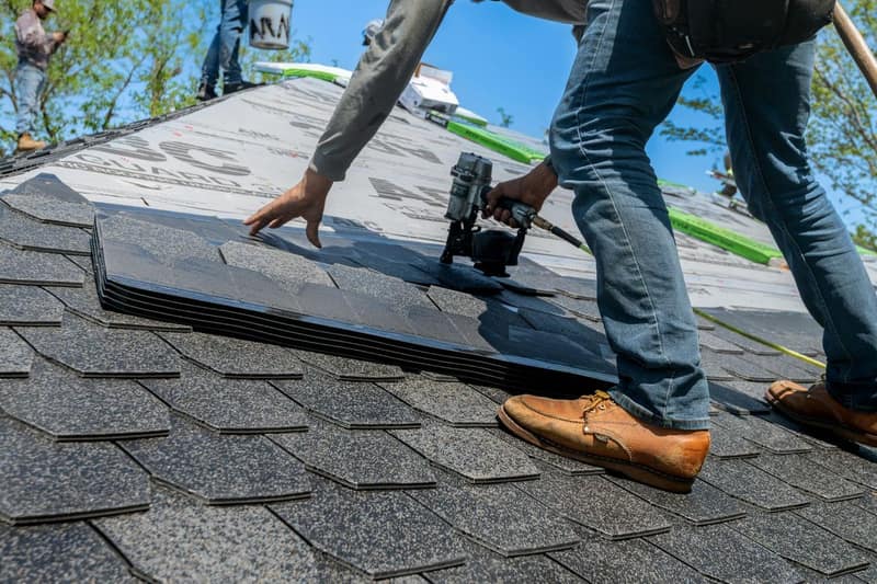 Roofing contractor at work